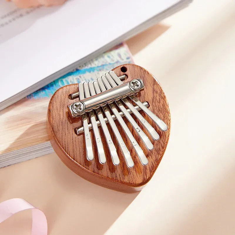 Piano à pouce 8 touches, Mini Kalimba exquis, piano à doigts portable, marimba pendentif, cadeau musical, clavier 8 touches, instrument de musique 11