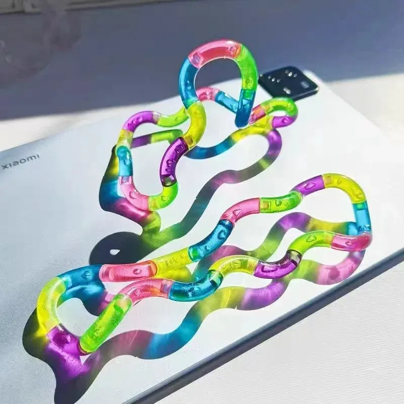 Jouet anti-stress en forme de nœud arc-en-ciel