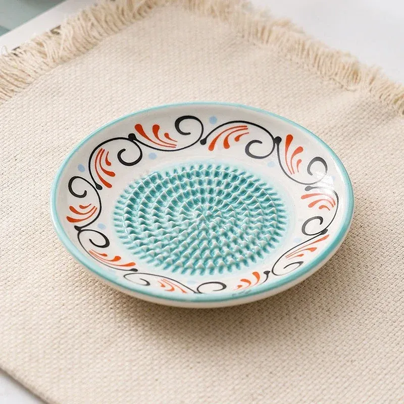Presse-ail en porcelaine