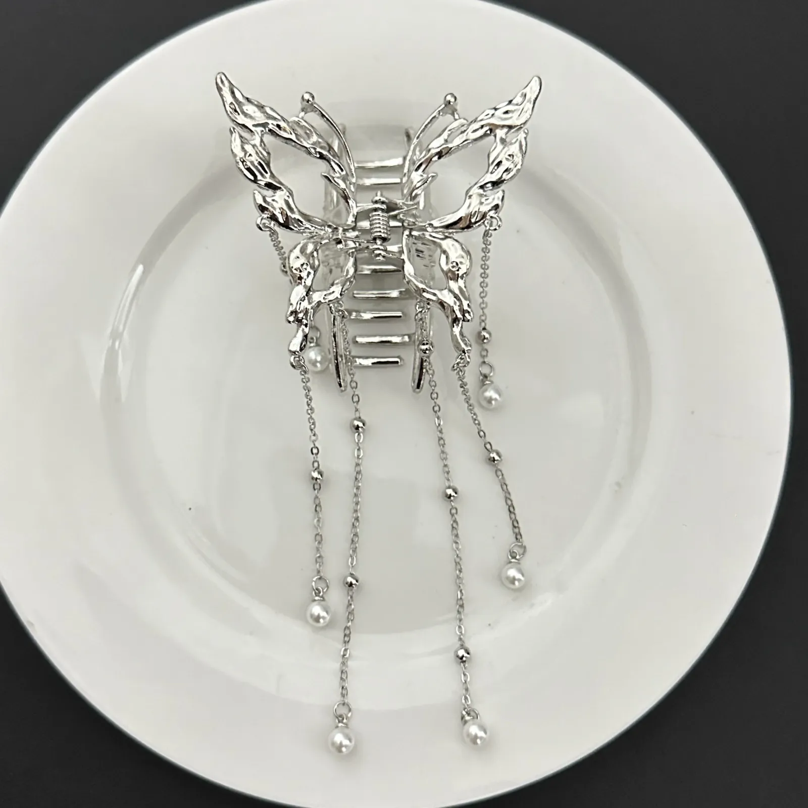 Pince papillon optique, finitions détaillées