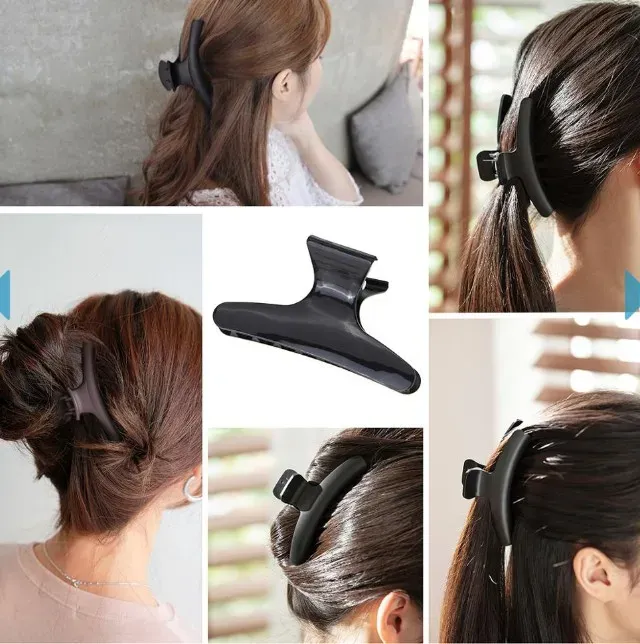 Pince papillon noire pour cheveux, vue rapprochée
