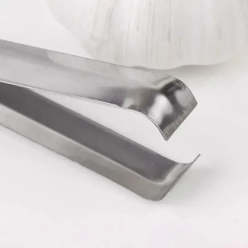 Épluche-ail en acier inoxydable, finition argentée