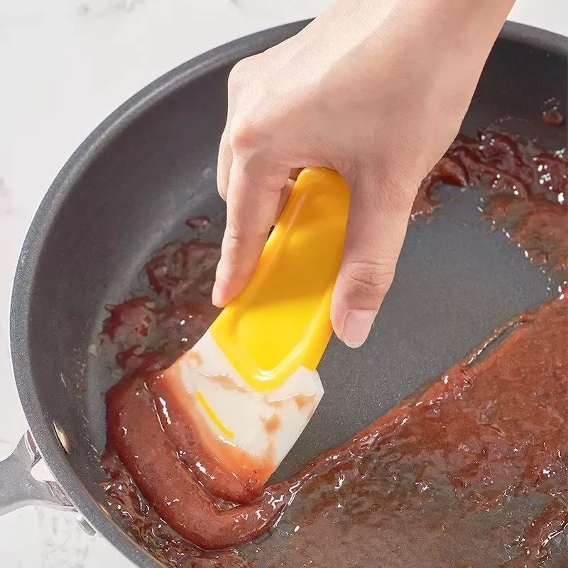Grattoir de cuisine en silicone, détail de la tête