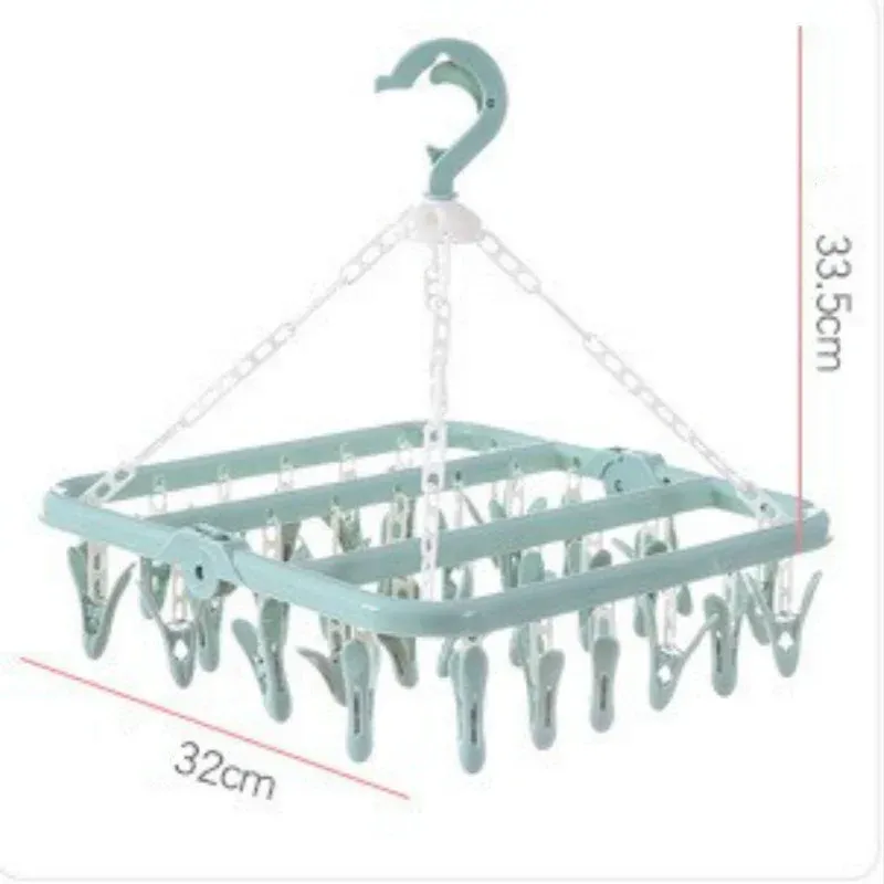 Vêtements de bébé séchant avec les pinces pliantes