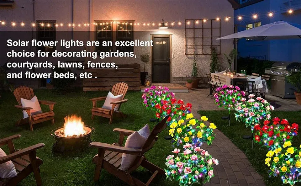 Lampes solaires installées dans un parterre de fleurs