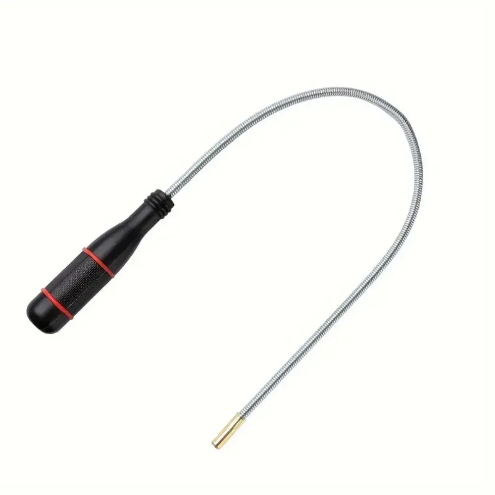Outil de ramassage magnétique pliable en situation d'utilisation