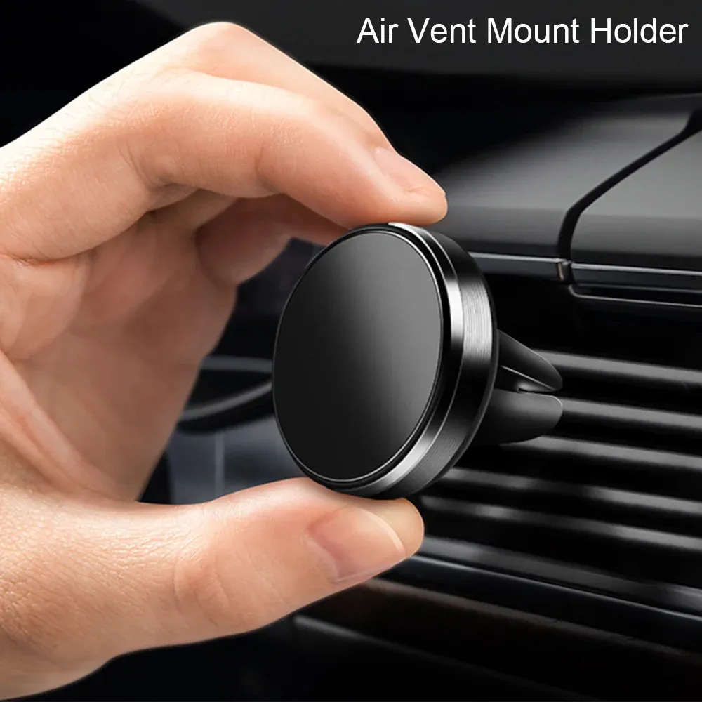 Téléphone maintenu par un support magnétique sur la grille d'aération de la voiture