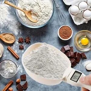 Cuillère-balance utilisée pour doser des croquettes