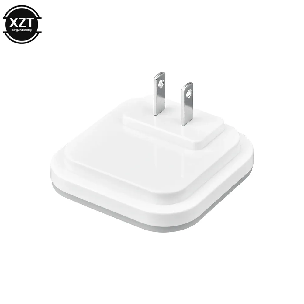 Veilleuse LED placée sur une table de chevet