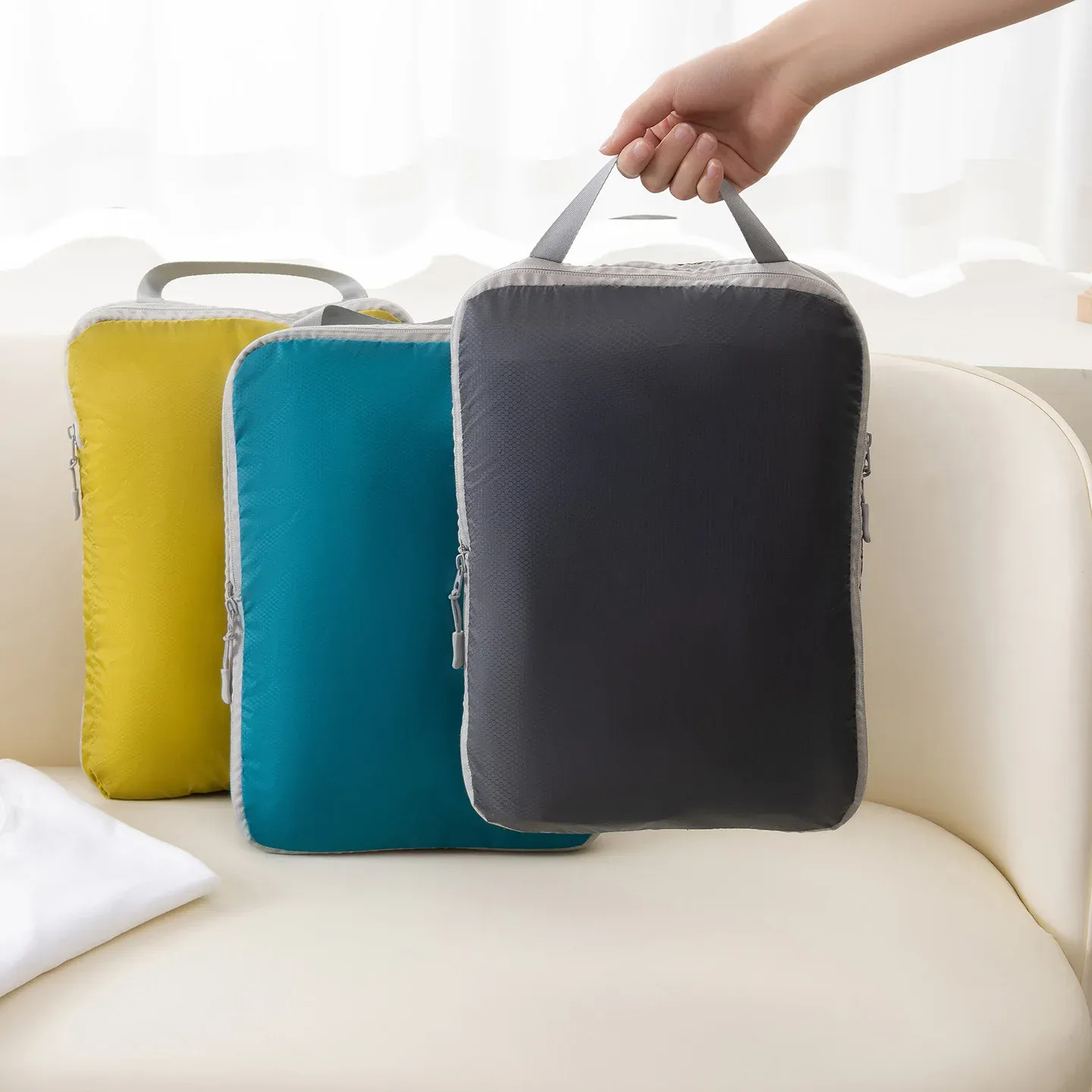Sac de rangement pliable et compressible pour vêtements de voyage