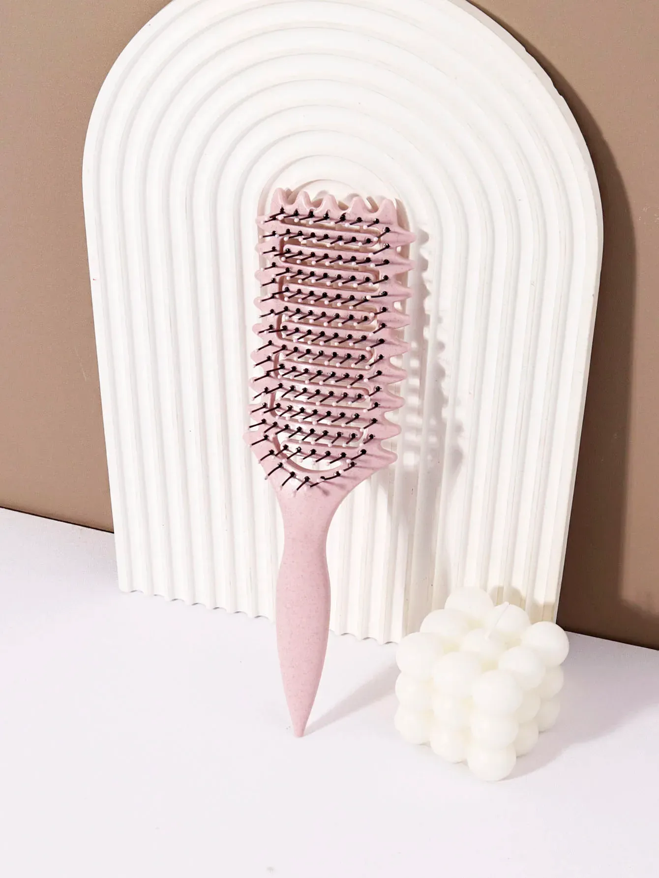 Brosse coiffante pour boucles, finition