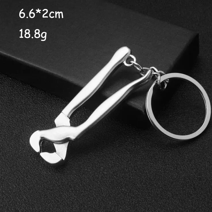 Porte-clés multifonction pour homme, outil d'extérieur compact avec règle, clé à marteau et pince pelle 26