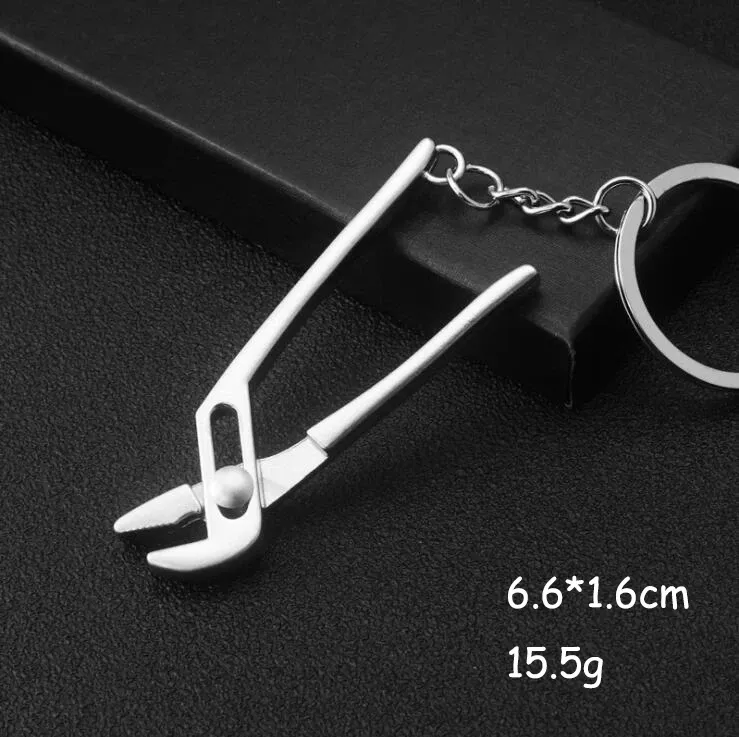 Porte-clés multifonction pour homme, outil d'extérieur compact avec règle, clé à marteau et pince pelle 12