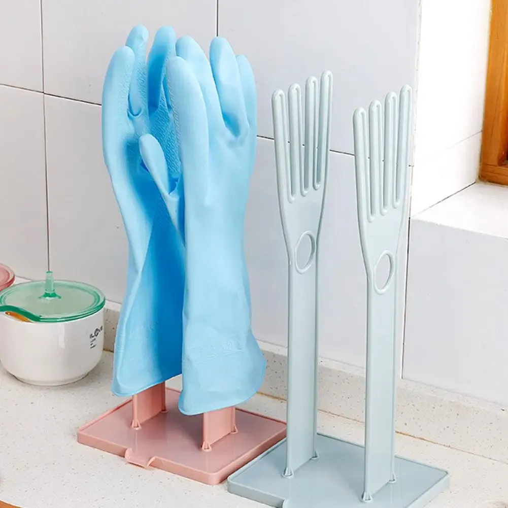 Support de séchage pour gants installé dans un évier de cuisine