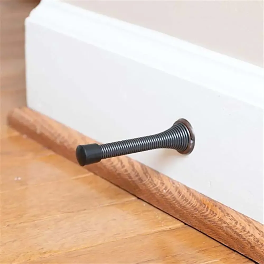 Butée de porte à ressort, détail de fixation