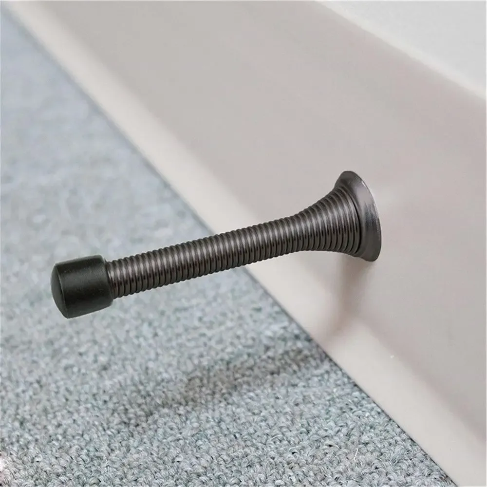 Butée de porte à ressort, installation