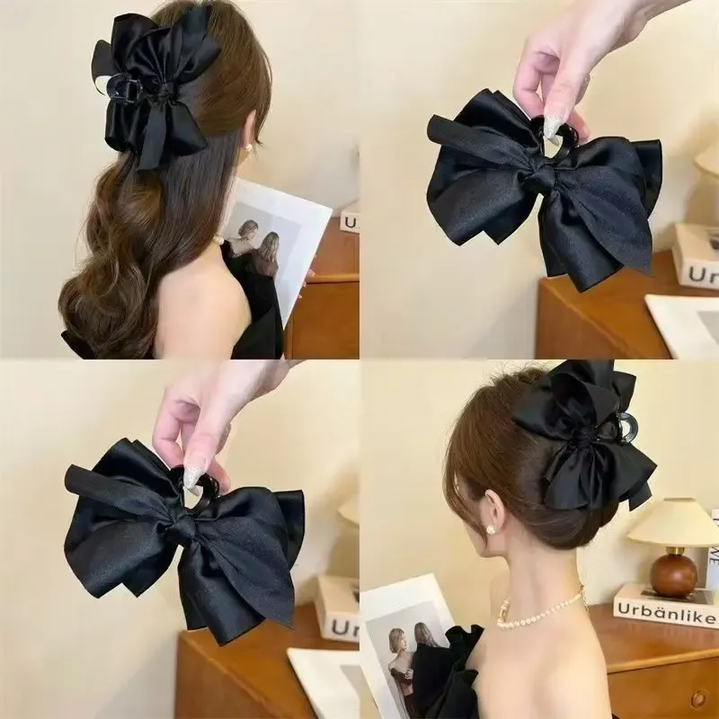 Grande pince à cheveux en forme de nœud noire, vue d'ensemble