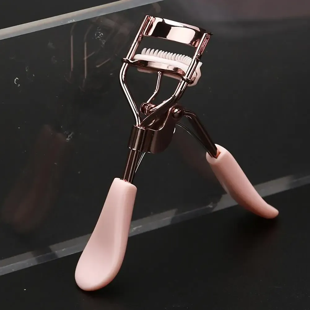 Recourbe-cils rose avec peigne, zoom