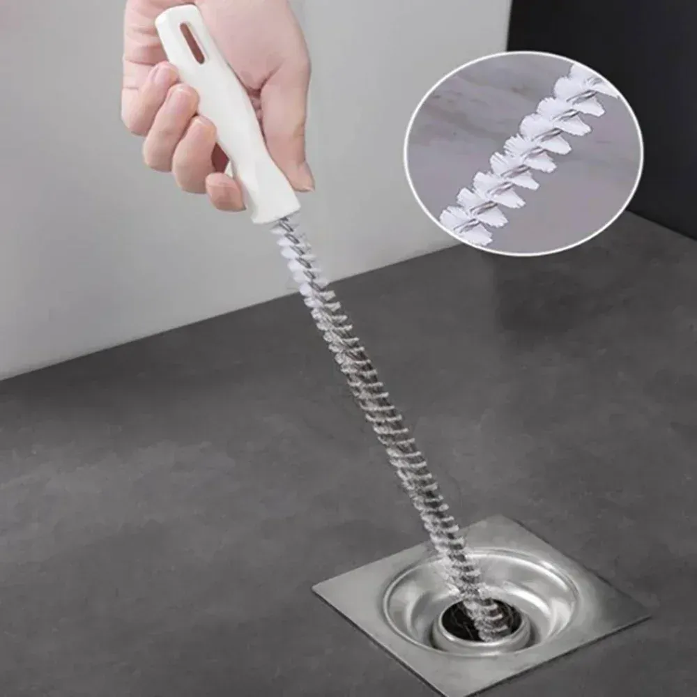 Utilisation de la brosse pour dégager une canalisation