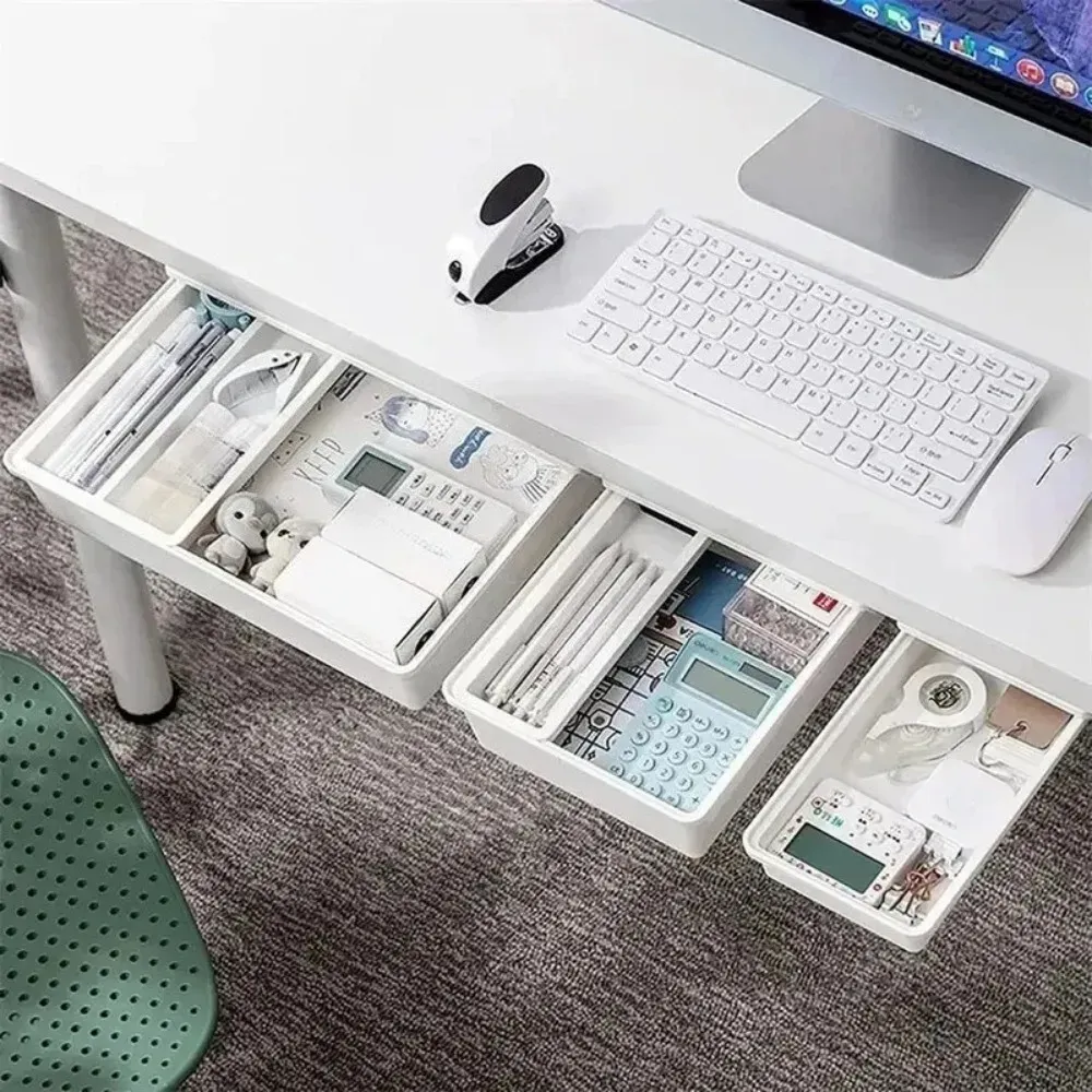 Tiroir de rangement dissimulé installé sous un bureau