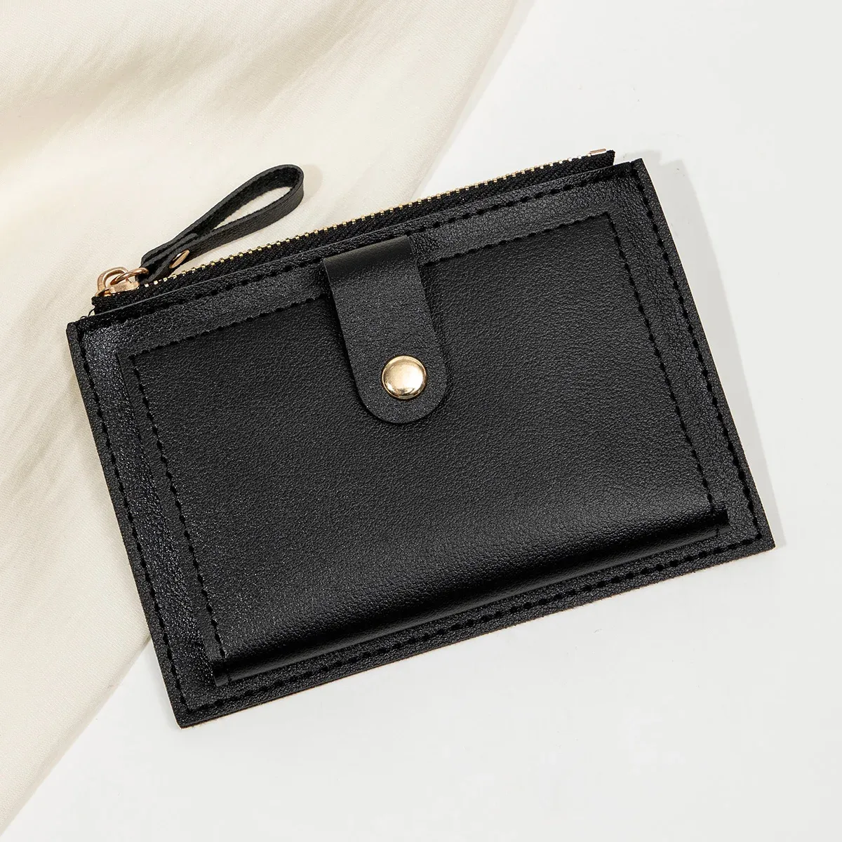 Porte-cartes femme, touche finale
