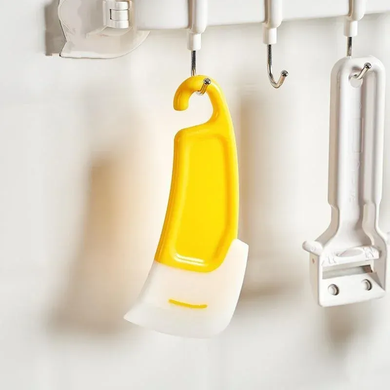Spatule grattoir utilisée pour le nettoyage de la vaisselle