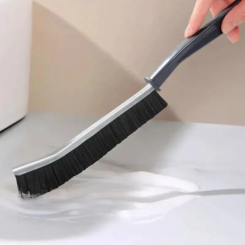 Manche ergonomique de la brosse