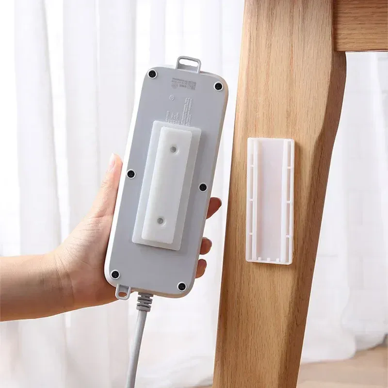 Fixateur de prise de bureau auto-adhésif